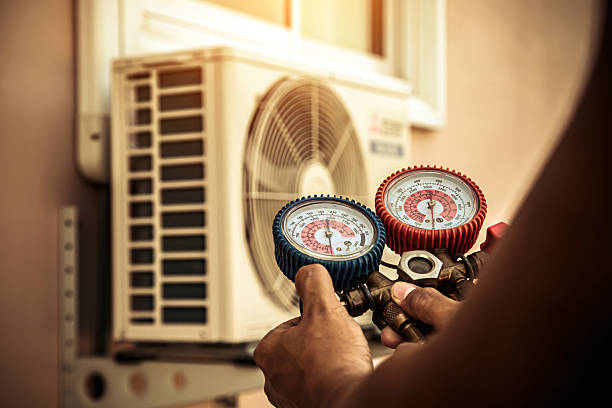 Professional Air Conditioning Service technician working in Palmer, IL